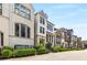 Modern townhomes are distinguished by white brick, black windows, black trim, metal fences, and low maintenance landscaping at 506 Broadview Ne Pl, Atlanta, GA 30324