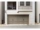 View of a two-car garage on a townhome with white painted brick and a small balcony above the garage at 506 Broadview Ne Pl, Atlanta, GA 30324