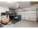 Epoxy-floor garage features storage, work bench, and overhead garage door with automatic opener at 506 Broadview Ne Pl, Atlanta, GA 30324
