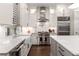Modern kitchen with stainless steel appliances, a farmhouse sink, and ample counter space at 506 Broadview Ne Pl, Atlanta, GA 30324