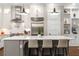 Bright kitchen with white cabinets, stainless steel appliances, and an island with seating at 506 Broadview Ne Pl, Atlanta, GA 30324