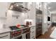 Modern kitchen with stainless steel appliances, white subway tiles, and a stainless vent hood at 506 Broadview Ne Pl, Atlanta, GA 30324