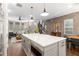 Spacious open kitchen with island seating, leading into the living area and staircase at 506 Broadview Ne Pl, Atlanta, GA 30324