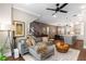 Open-concept living room with an adjacent dining and kitchen area, modern decor, and neutral color palette at 506 Broadview Ne Pl, Atlanta, GA 30324