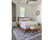 Nicely decorated bedroom with a comfortable bed, bedside tables, and a cozy rug at 5310 Lyndale Cir, Forest Park, GA 30297