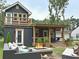 Back exterior of home with outdoor seating and a fire pit, along with an upper deck at 5310 Lyndale Cir, Forest Park, GA 30297