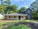 Charming two-story home with a covered porch and freshly landscaped front yard at 5310 Lyndale Cir, Forest Park, GA 30297