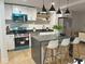 Modern kitchen with stainless steel appliances, white cabinets, and a center island with seating at 5310 Lyndale Cir, Forest Park, GA 30297
