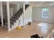 Bright living room with new flooring and a staircase at 5310 Lyndale Cir, Forest Park, GA 30297