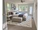 Elegantly staged bedroom with large windows, neutral tones, and stylish decor at 5310 Lyndale Cir, Forest Park, GA 30297