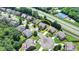 View of the home's location in a beautiful neighborhood, surrounded by mature trees and other lovely homes at 5485 Sandstone Ct, Cumming, GA 30040
