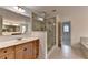 Bathroom featuring walk-in shower and modern sink at 5485 Sandstone Ct, Cumming, GA 30040