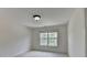 Bright bedroom featuring a window providing ample natural light at 5485 Sandstone Ct, Cumming, GA 30040