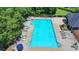 Community pool offering a relaxing retreat with ample seating and stunning surroundings, great for summer relaxation at 5485 Sandstone Ct, Cumming, GA 30040