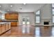 Open kitchen with hardwood floors, wood cabinets, granite countertop and stainless steel appliances at 5485 Sandstone Ct, Cumming, GA 30040