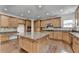 Gourmet kitchen featuring granite countertops, stainless steel appliances, and custom cabinetry at 5485 Sandstone Ct, Cumming, GA 30040