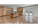 Gourmet kitchen with wood cabinets, central island with granite countertop and stainless steel appliances at 5485 Sandstone Ct, Cumming, GA 30040