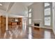 Spacious living room seamlessly connected to the kitchen with hardwood floors at 5485 Sandstone Ct, Cumming, GA 30040