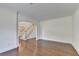 Spacious living room with hardwood floors, neutral walls, and arched doorway at 5485 Sandstone Ct, Cumming, GA 30040