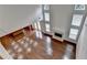 Bright open living room boasting gleaming hardwood floors, fireplace and soaring ceilings at 5485 Sandstone Ct, Cumming, GA 30040