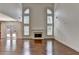 Open-concept living room featuring a fireplace and access to the backyard at 5485 Sandstone Ct, Cumming, GA 30040