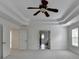 Carpeted main bedroom highlighting ceiling fan at 5485 Sandstone Ct, Cumming, GA 30040