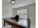 Office with a large desk, neutral carpet and a window bringing in natural light at 5485 Sandstone Ct, Cumming, GA 30040