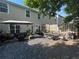 Spacious backyard with an umbrella-covered patio, a dining set, and lovely patio furniture for outdoor relaxation and entertainment at 127 Spring Way Sq, Canton, GA 30114
