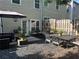 Inviting backyard with patio furniture, a dining table, and an umbrella that is perfect for outdoor entertainment and relaxation at 127 Spring Way Sq, Canton, GA 30114