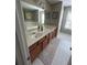 Bathroom with double sinks and a large mirror at 127 Spring Way Sq, Canton, GA 30114