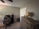Bedroom with a globe, dark furnishings, and desk creating a balanced and functional living space at 127 Spring Way Sq, Canton, GA 30114