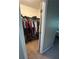 View inside the closet, stocked with clothes at 127 Spring Way Sq, Canton, GA 30114