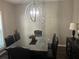 Dining area featuring a modern chandelier and a large dining table at 127 Spring Way Sq, Canton, GA 30114