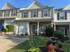 Charming townhome with a well-manicured lawn and inviting curb appeal at 127 Spring Way Sq, Canton, GA 30114