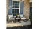 Inviting front porch sitting area, great for relaxing and enjoying the outdoors at 127 Spring Way Sq, Canton, GA 30114