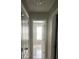 Hallway view showing the light tile floor at 127 Spring Way Sq, Canton, GA 30114