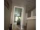 Hallway view leading to the bedroom with a window at 127 Spring Way Sq, Canton, GA 30114