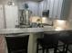 Cozy kitchen with bar stool seating, stainless steel appliances, subway tile and granite countertops at 127 Spring Way Sq, Canton, GA 30114