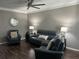 Well-decorated living room featuring dark floors, soft lighting, and comfortable seating at 127 Spring Way Sq, Canton, GA 30114