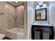 Nicely tiled bathroom with a shower and vanity at 1723 Woodbow Path, Dacula, GA 30019