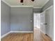 A gray bedroom features hardwood floors and white trim, providing a calm and inviting space at 1723 Woodbow Path, Dacula, GA 30019