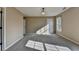 Bedroom featuring large windows, carpet, and decorative lighting at 1723 Woodbow Path, Dacula, GA 30019