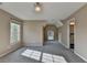 Bedroom featuring large windows, carpet, and decorative lighting at 1723 Woodbow Path, Dacula, GA 30019