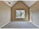 Bright bedroom with vaulted ceiling and window for natural light at 1723 Woodbow Path, Dacula, GA 30019