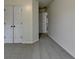 A simple carpeted bedroom features a double door closet for ample storage at 1723 Woodbow Path, Dacula, GA 30019