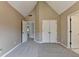 Spacious bedroom features neutral carpet, a high ceiling, and ample closet space at 1723 Woodbow Path, Dacula, GA 30019