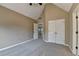 Spacious bedroom features neutral carpet, a high ceiling, and ample closet space at 1723 Woodbow Path, Dacula, GA 30019