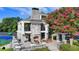 The clubhouse is stone and stucco with a fireplace, balconies, and outdoor seating areas at 1723 Woodbow Path, Dacula, GA 30019