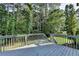 Outdoor deck overlooking a private, wooded backyard at 1723 Woodbow Path, Dacula, GA 30019