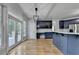 Eat-in kitchen with doors to the deck features stainless appliances and ample counterspace at 1723 Woodbow Path, Dacula, GA 30019